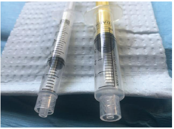 Figure 2. Luer syringe (left) tip extends beyond the collar. NRFit syringe (right) tip is flush with the collar.
