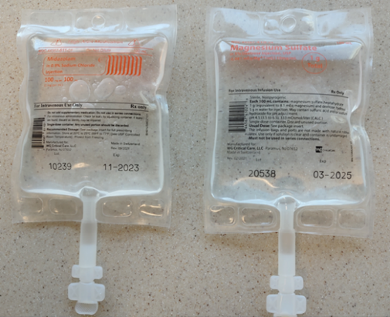 Figure 2. Once removed from the overwrap, midazolam 100 mg per 100 mL (left) and magnesium sulfate 1 g per 100 mL (right) bags by WG Critical Care have similar labels with the drug name and dose printed using a light orange font on a clear background.