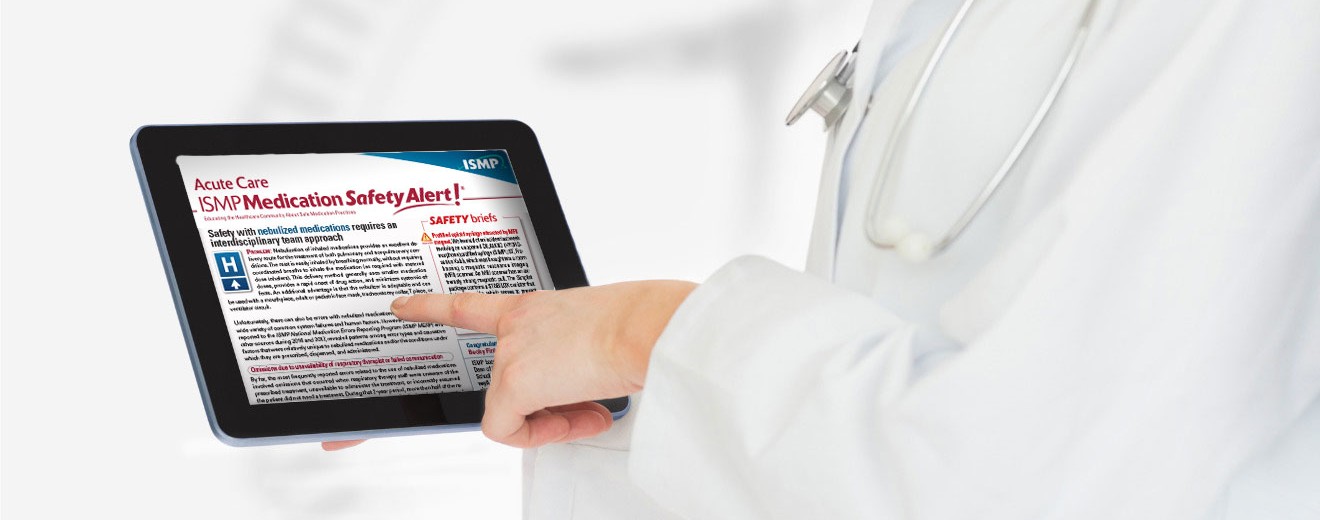 healthcare practitioner reading the ISMP Medication Safety Alert! on a digital tablet